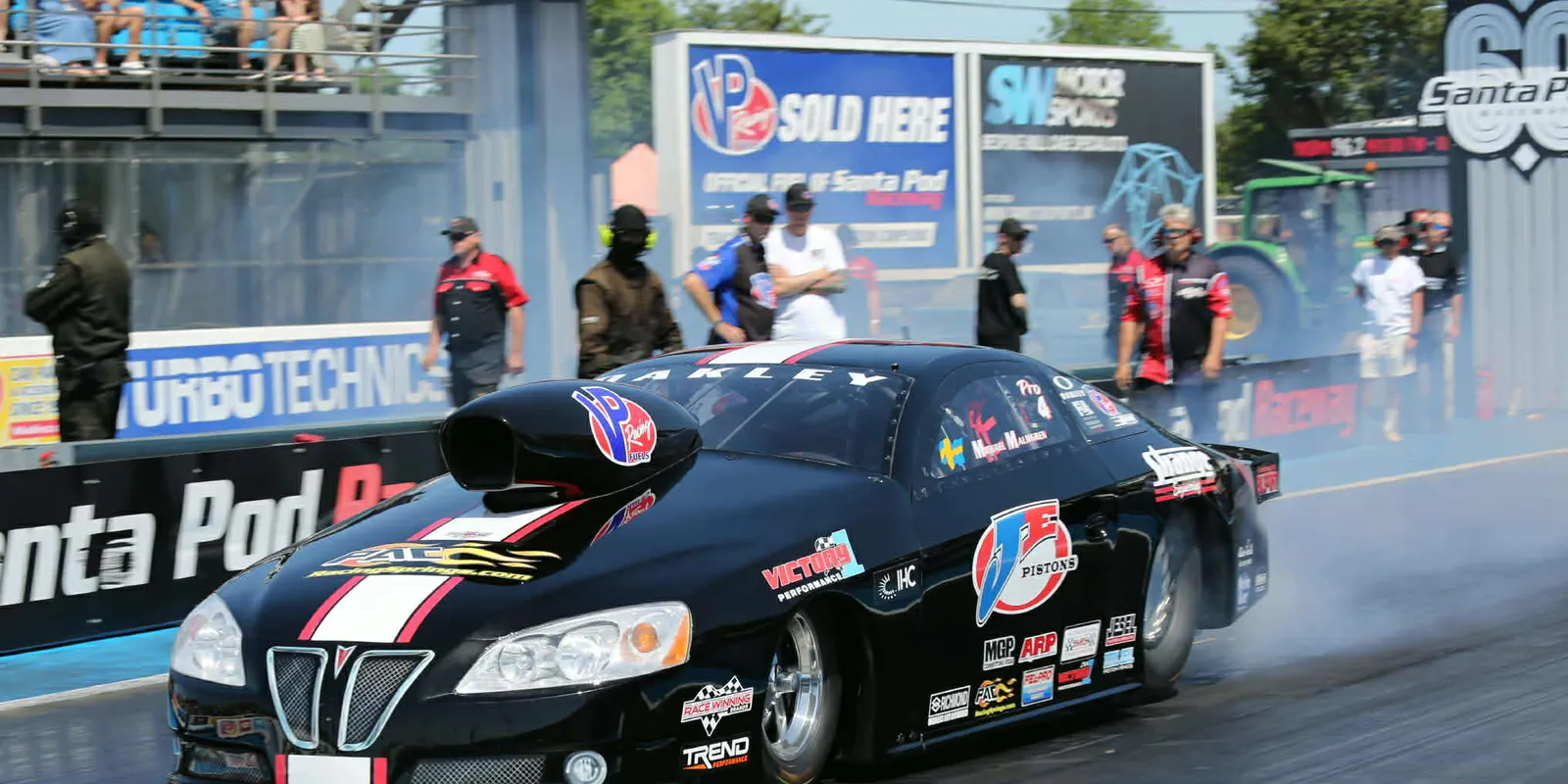 Michael Malmgren's Pro Stock car doing a burnout at Santa Pod